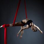 elegant girl doing an acrobatic move