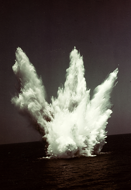 Water blast rising from the ocean surface